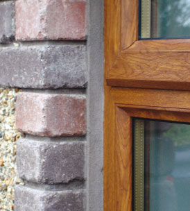 Light Oak window with cement pointing
