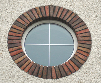 White circular window with Neo Georgian insert