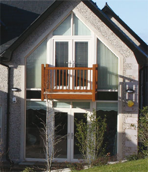 Cream 2 storey apex frame with black spandrel panel